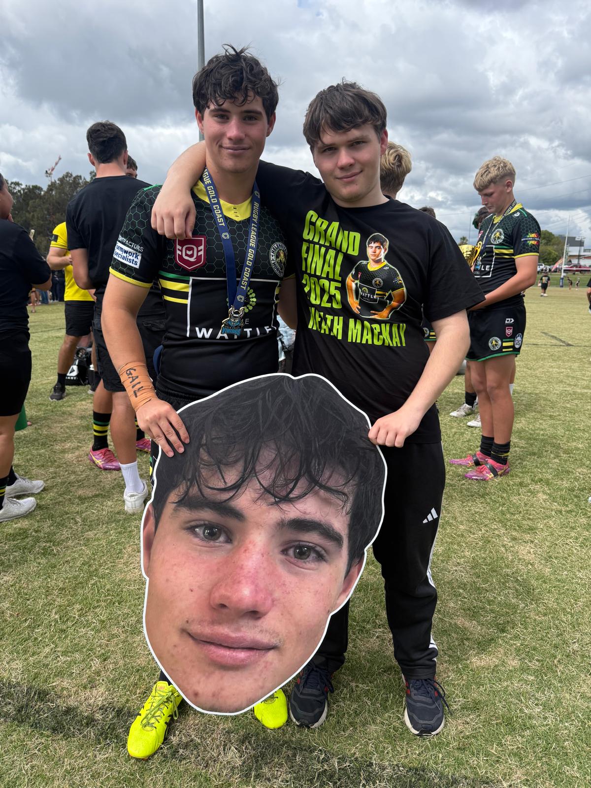 Two mates with a Big Head at the grand final