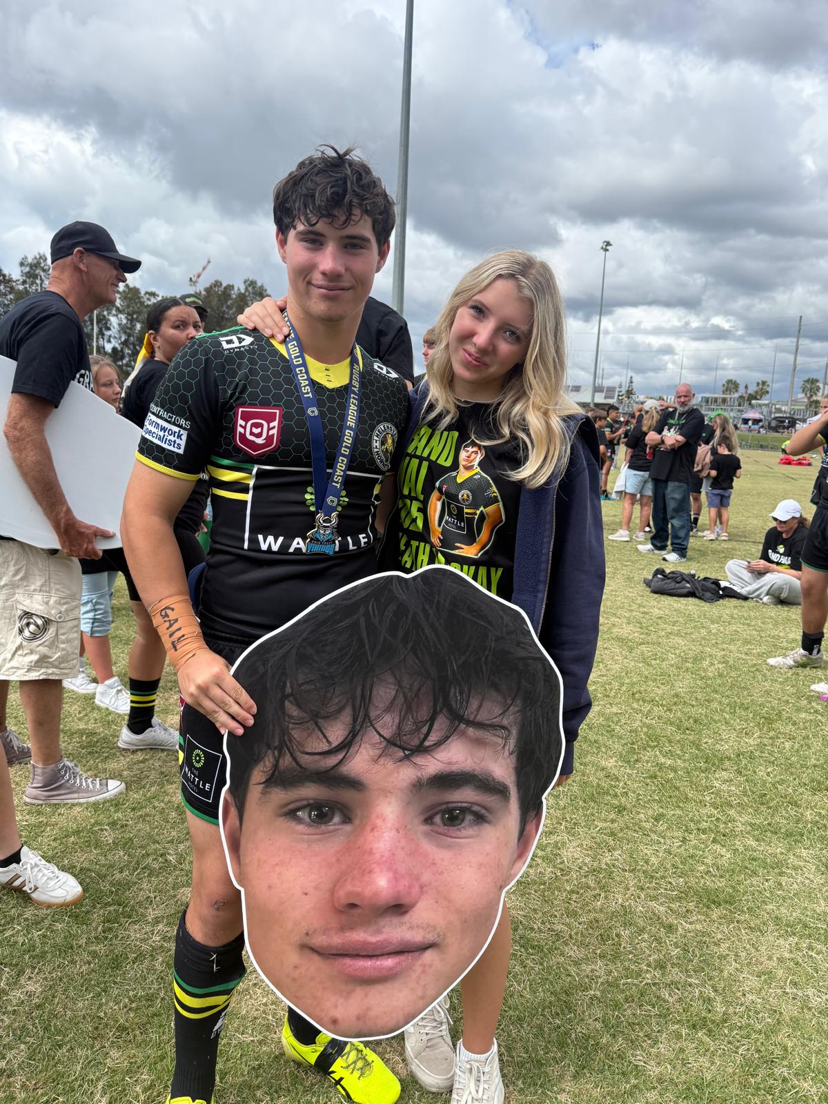 Medal winner with supporter and Big Head